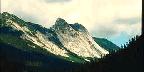 Mountains Behind Red Outcropping