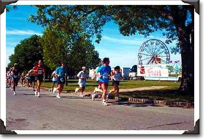 Marathoners pass amusement park Marathoners pass amusement park