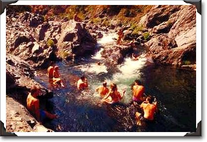 Hikers enjoy a High Sierra mountain pool Hikers enjoy a High Sierra mountain pool