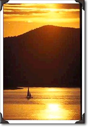 Sailboat at sunset on Lake Pleasant, northwest of Phoenix Sailboat at sunset on Lake Pleasant, northwest of Phoenix