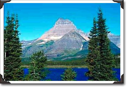 Morning reflections of Mount Wilbur in Swiftcurrent Lake, Montana Morning reflections of Mount Wilbur in Swiftcurrent Lake, Montana