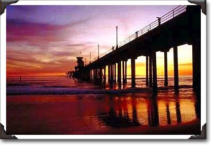 Low tide reflections at sundown, Huntington Beach pier, California Low tide reflections at sundown, Huntington Beach pier, California