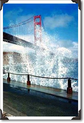 Golden Gate Bridge and wave spray from the seawall, San Francisco Golden Gate Bridge and wave spray from the seawall, San Francisco
