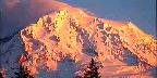 Golden Sunset On Cloud Topped Mountain