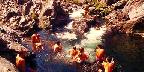 Hikers enjoy a High Sierra mountain pool