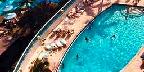 Rooftop condo pool overlooking Outrigger Hotel pool