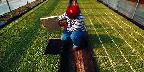 Sammy checks root growth on his tobacco plants, Glasgow, ...